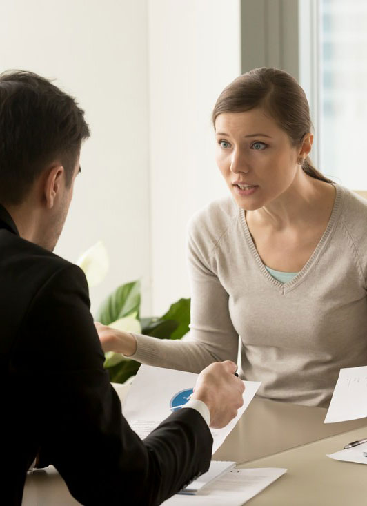 Man and woman involved in a verbal confrontation