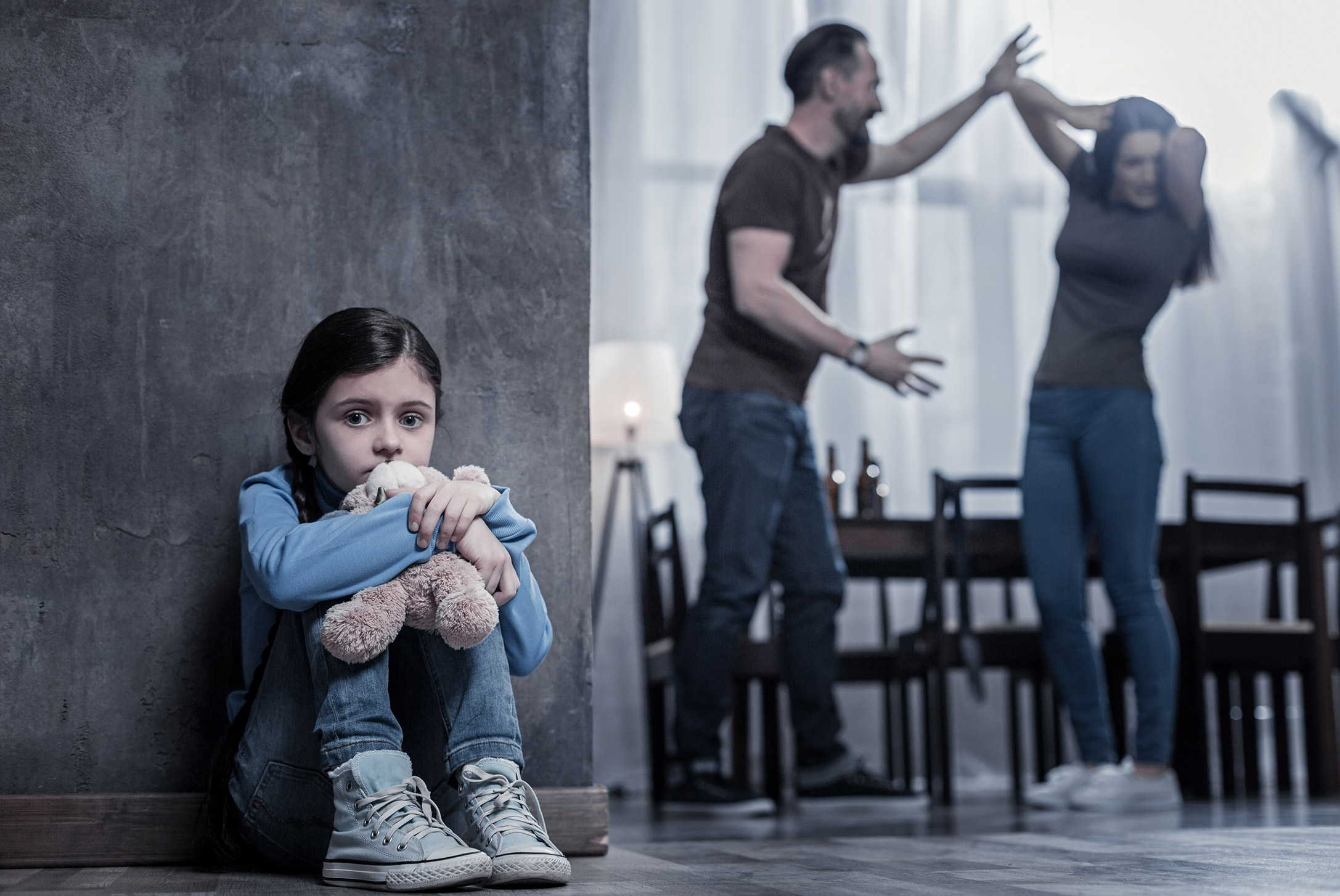 Child dealing with domestic violence between parents in the home